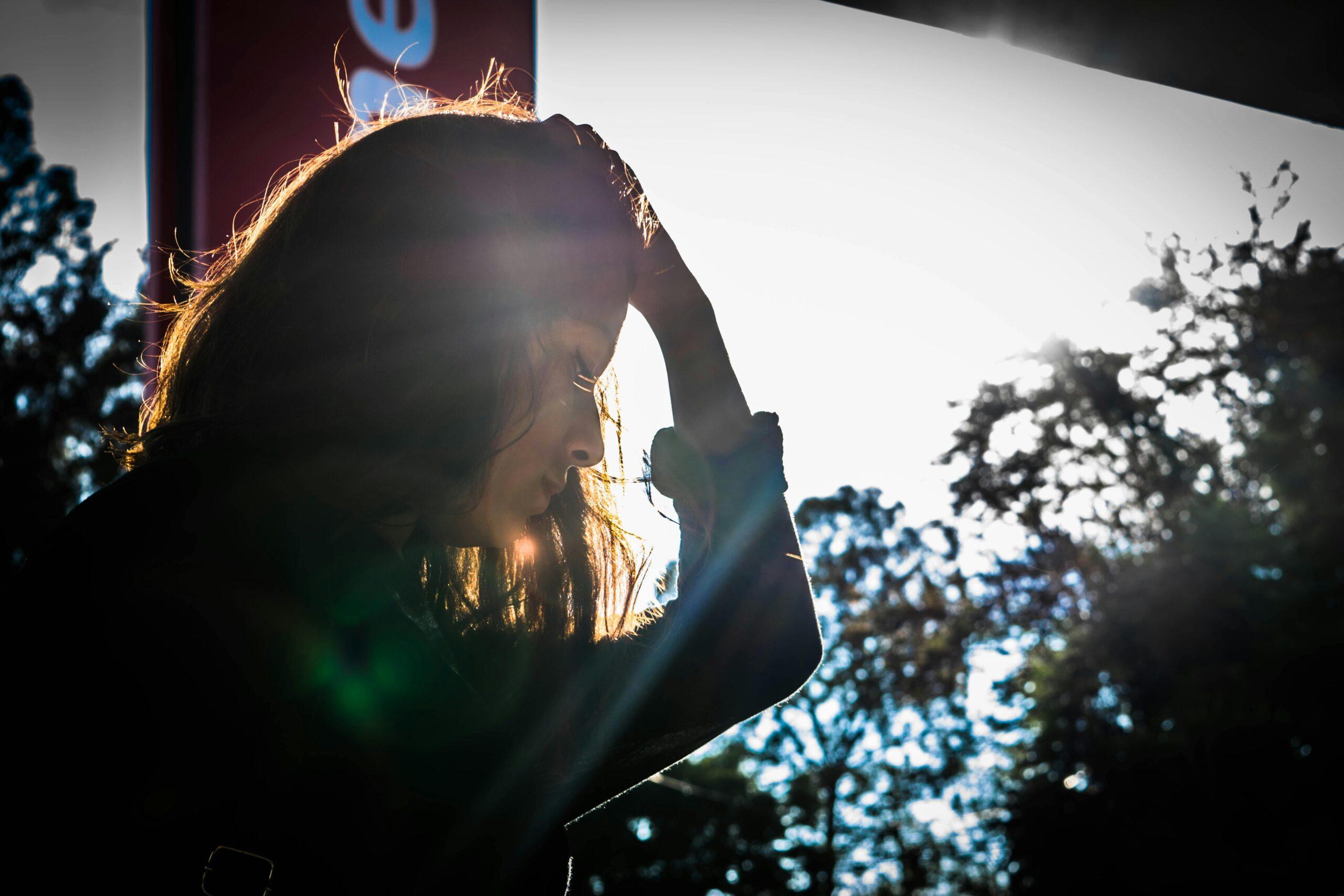 sad woman at sunset