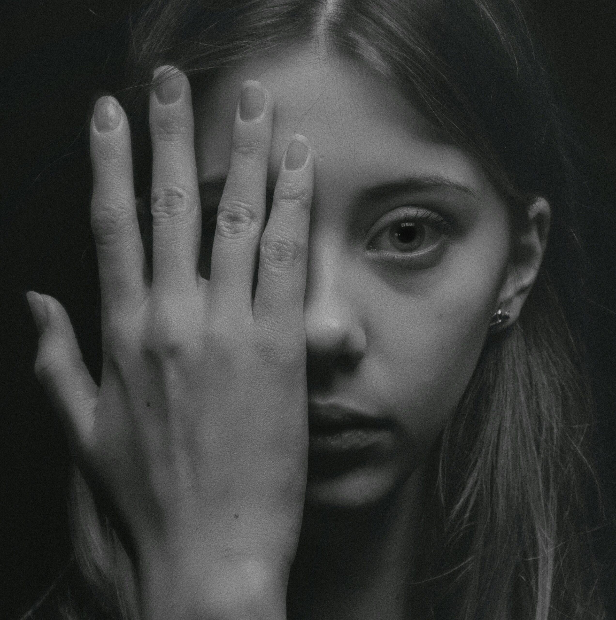 girl covering eye